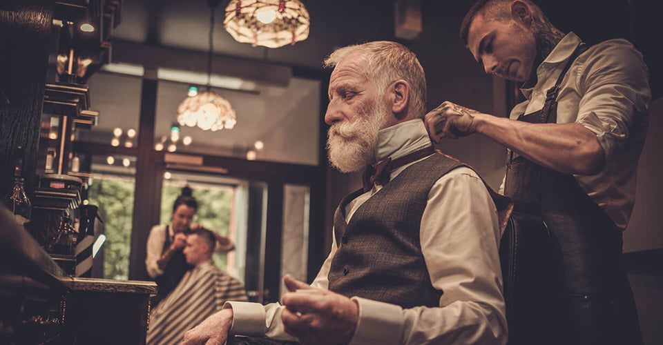 Old man dressing hair in salon
